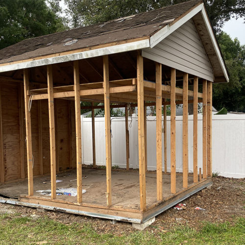 shed stripped down to framing during shed demolition in Winter Haven, FL