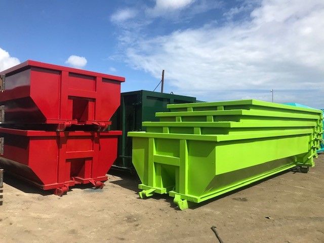 dumpsters stacked inside of each other