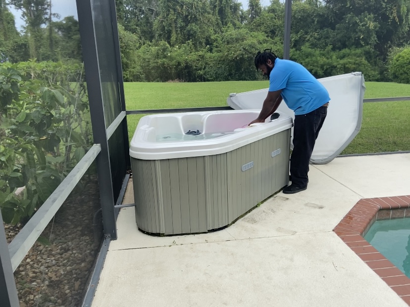 man removing water from hot tub before removing it in Winter Haven, FL